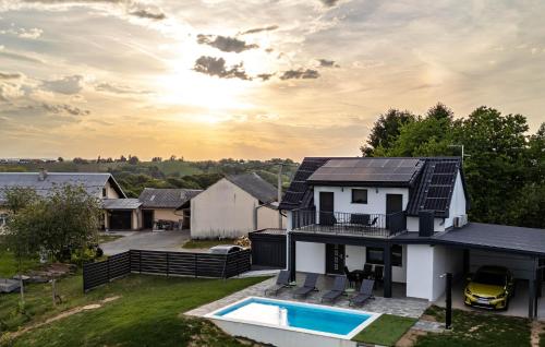 a house with solar panels on the roof at Amazing Home In Banfi in Štrigova