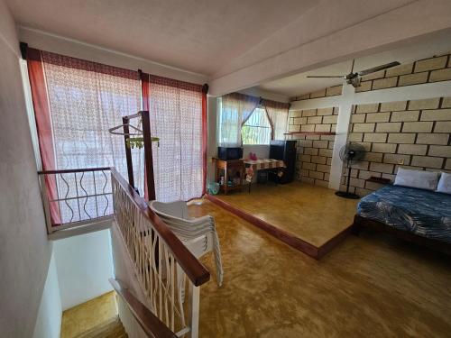 a bedroom with a bed and a staircase in a room at Departamento El Dorado in Barrio Nuevo