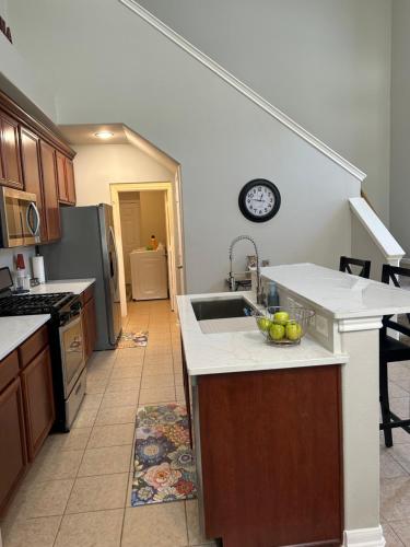 a kitchen with a sink and a counter top at Lovely Boho Chic Garden Home in Spring