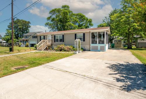 a house with a driveway in front of it at One Peace Cottage in Deep Hole