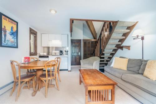 a living room with a couch and a table at Manitou Lodge 7 by Alpine Lodging Telluride in Telluride