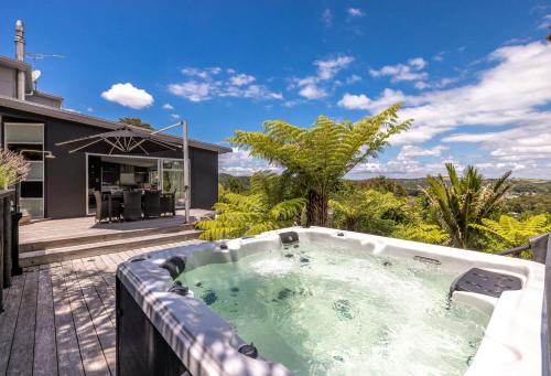 a hot tub on the deck of a house at Paradise at Palm Beach in Palm Beach