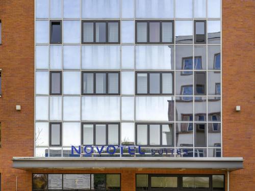 a building with a sign on the front of it at Novotel Suites Berlin City Potsdamer Platz in Berlin