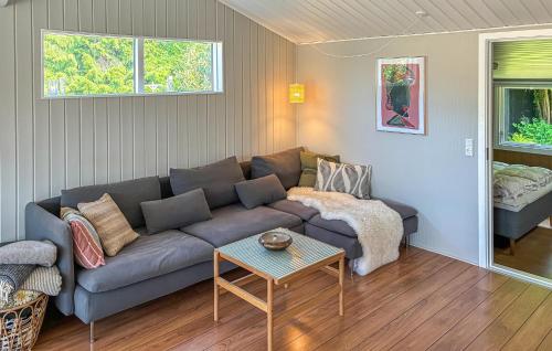 a living room with a couch and a table at 2 Bedroom Stunning Home In Vordingborg in Vordingborg