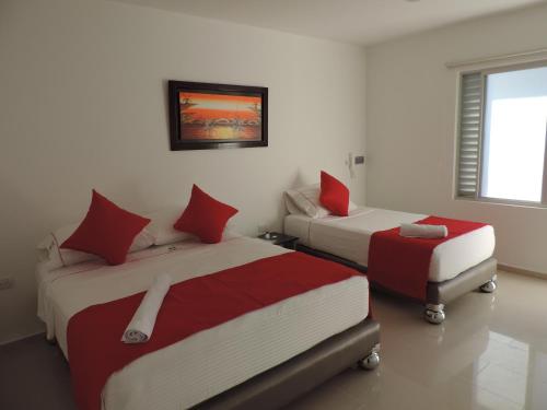 Tempat tidur dalam kamar di Hotel Único Plaza