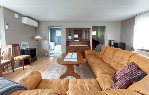 a living room with a couch and a table at Paulinas Hus in Laholm