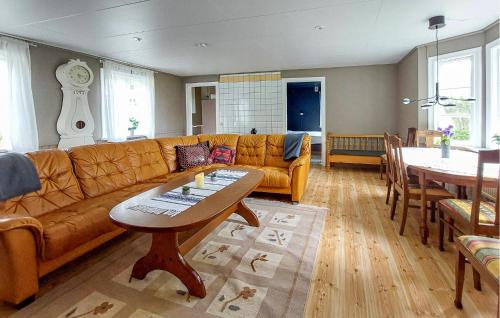 a living room with a couch and a table at Paulinas Hus in Laholm