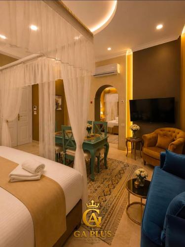 a bedroom with a bed and a living room at GA Cairo Hotel Downtown in Cairo