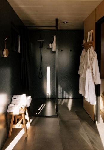 a bathroom with a shower and a glass door at Heyscape Denmark in Denmark