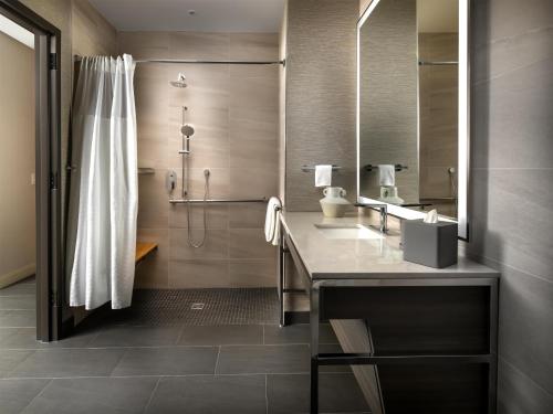 a bathroom with a shower and a toilet and a sink at Grand Hyatt Deer Valley in Park City