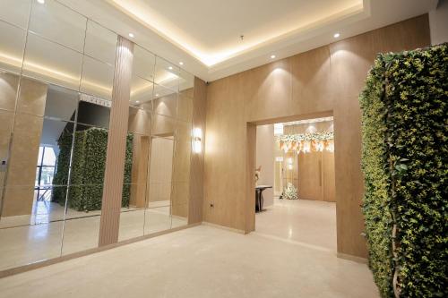 a lobby with a large wall of plants at Hotel Dwarkamai, A Pure Vegetarian Hotel in Nagpur