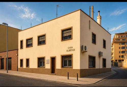 a large white building on a city street at Apartamentos Albeniz in Algeciras