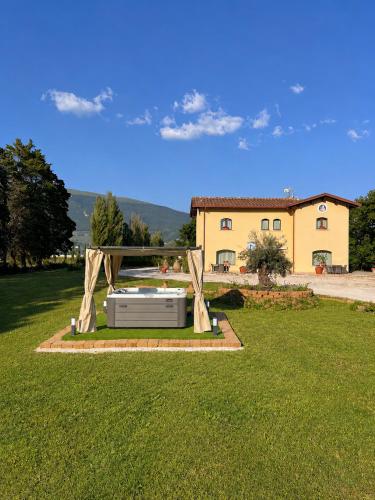 a garden with an object in the grass at Il Castellaccio in Spello