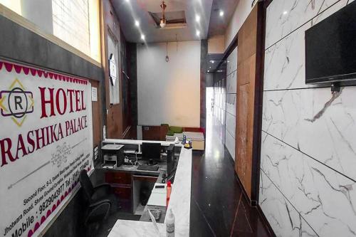 a room with a hotel yakima blade sign on the wall at Hotel Rashika Palace Near Sindhi Camp Bus Stand, Jaipur in Jaipur