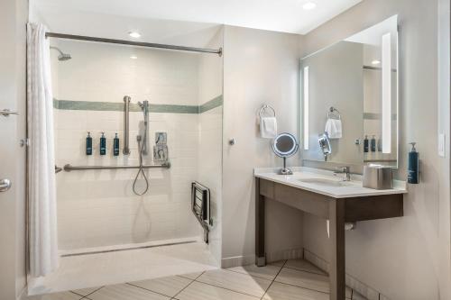 a bathroom with a shower and a sink at Hilton Grand Vacations Club Ocean 22 Myrtle Beach in Myrtle Beach