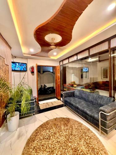 a living room with a couch and a table at Shiv Dham Palace in Varanasi