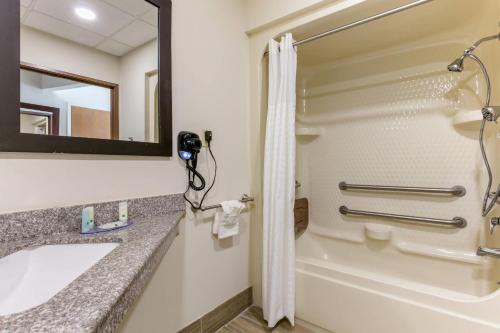 a bathroom with a sink and a shower at Quality Inn Cape Girardeau North in Cape Girardeau