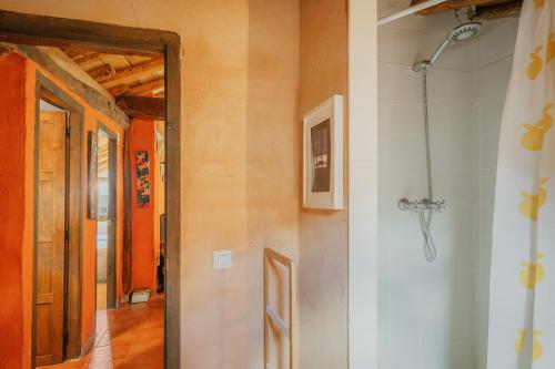 a hallway with an open door to a room at Casa La Romana in Ayllón
