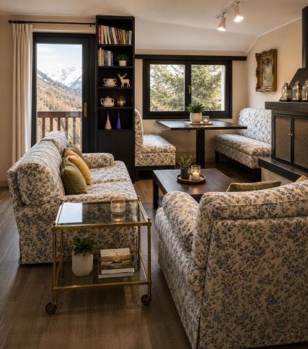 a living room with two couches and a fireplace at ComeCasa La Magdeleine 2BDR APT in La Magdeleine