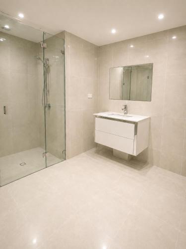 a bathroom with a sink and a shower at Light-Filled Modern Home 3BR Pet-Friendly 5km-CBD in Perth