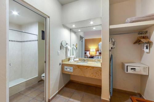 a bathroom with a sink and a shower and a toilet at Comfort Inn Tampico in Tampico