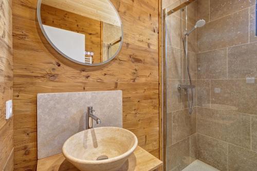 a bathroom with a sink and a shower at Lodge Spa Celeste in Sarlat-la-Canéda