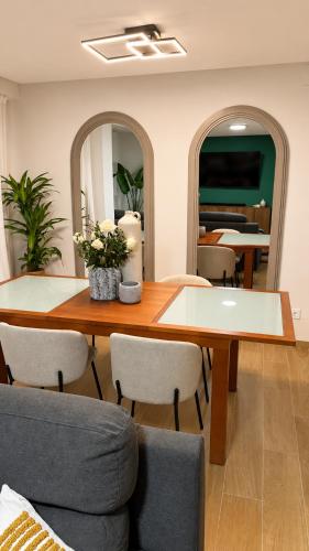 a dining room with a table and chairs at Tranquilo in Elche