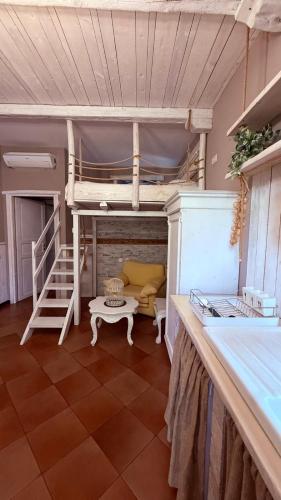 a room with a bunk bed and a table at Casa Everest in Malgrate