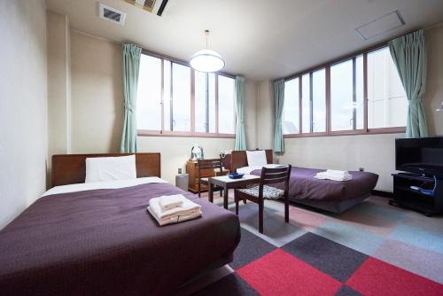 Tempat tidur dalam kamar di Hotel Select Inn Furukawa