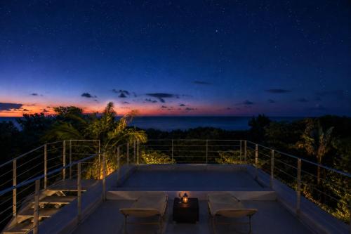 a view from the deck of a house at night at The Seven Stars Resort in Ishigaki Island
