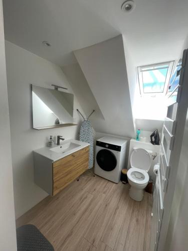 a small bathroom with a toilet and a sink at herseaux in Mouscron