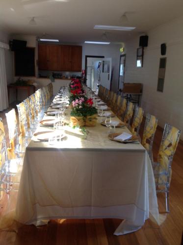 a long table in a room with chairs at Tranquilles Bed & Breakfast in Port Sorell