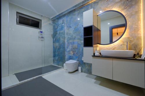 a bathroom with a shower and a sink and a mirror at EDEN NEST EXCLUSIVE HOTEL in Belek