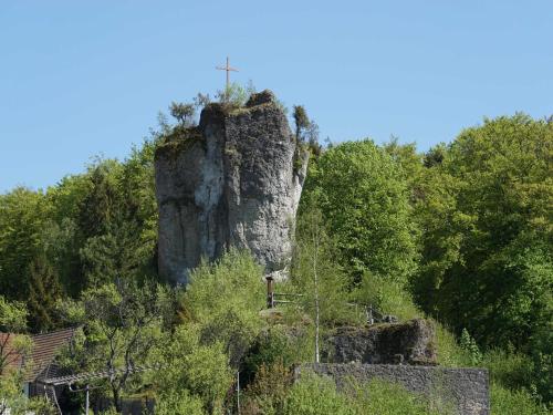 a large rock with a cross on top of it at Haus Burgblick in Obertrubach