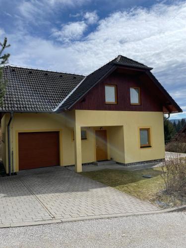 a house with a red and yellow at LIPNO Hideaway in Kramolín