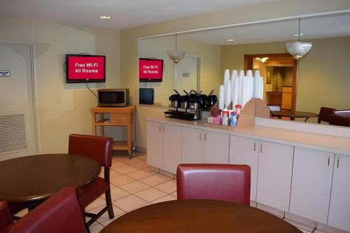 a restaurant with two tables and chairs and a counter at Boardman in McKays Corners