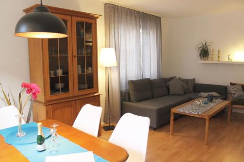 a living room with a couch and a table at Ferienwohnung Sonnblick in Bad Gastein