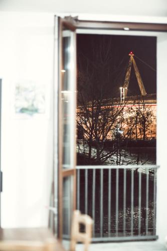 a window with a view of the eiffel tower at La Boheme SMART Hotel in Turin