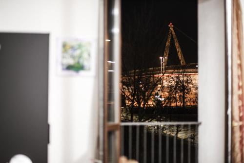 a view of a crane seen through a window at La Boheme SMART Hotel in Turin