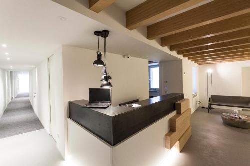 a room with a desk with a laptop on it at Casa Alla Lega in Arco