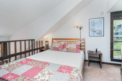 a bedroom with two beds and a window at Manitou Lodge 11 by Alpine Lodging Telluride in Telluride
