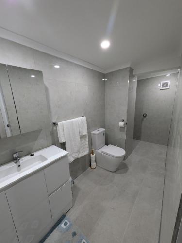 a bathroom with a toilet and a sink and a shower at Private Coastal Sanctuary Beachside Escape in Bunbury