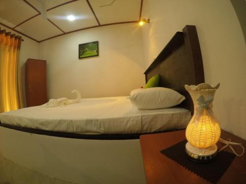 מיטה או מיטות בחדר ב-Susee Villa