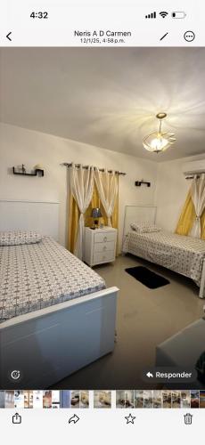 a bedroom with two beds in a room at El rincón de Sánchez in Moca