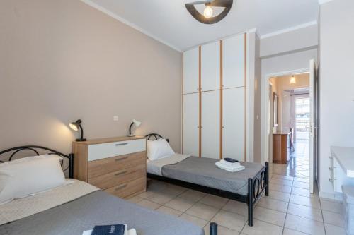 En eller flere senge i et værelse på VNM Apartment
