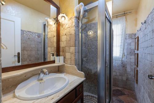 a bathroom with a sink and a shower at Cypress House La Zubia in La Zubia