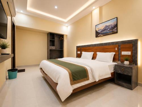 a bedroom with a large bed in a room at Guest House RK inn in Gorakhpur