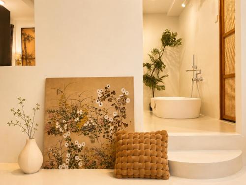 a bathroom with a painting of a bathroom with a tub at YOLO Bangkok Boutique Hotel in Bangkok