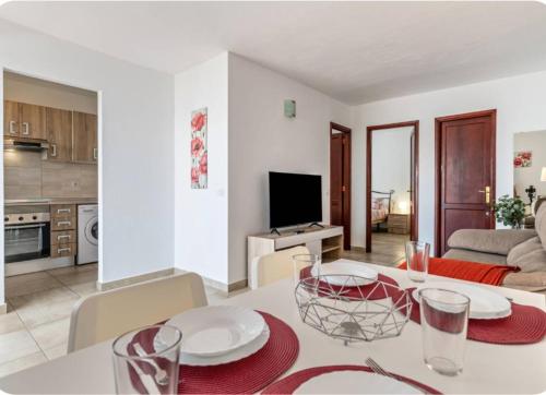 a kitchen and living room with a table and chairs at Barlovento Apartment 2 in Playa Honda