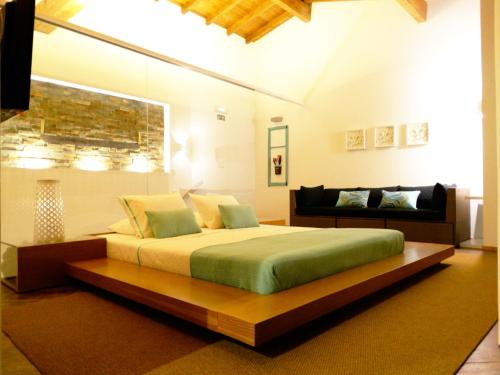 Tempat tidur dalam kamar di Quinta Cercas da Costa